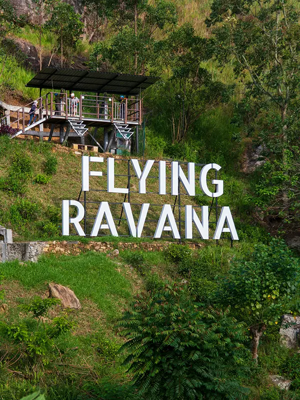 The large 'FLYING RAVANA' sign on the hillside, advertising the zip line, one of the most thrilling things to do in Ella for adventure seekers.