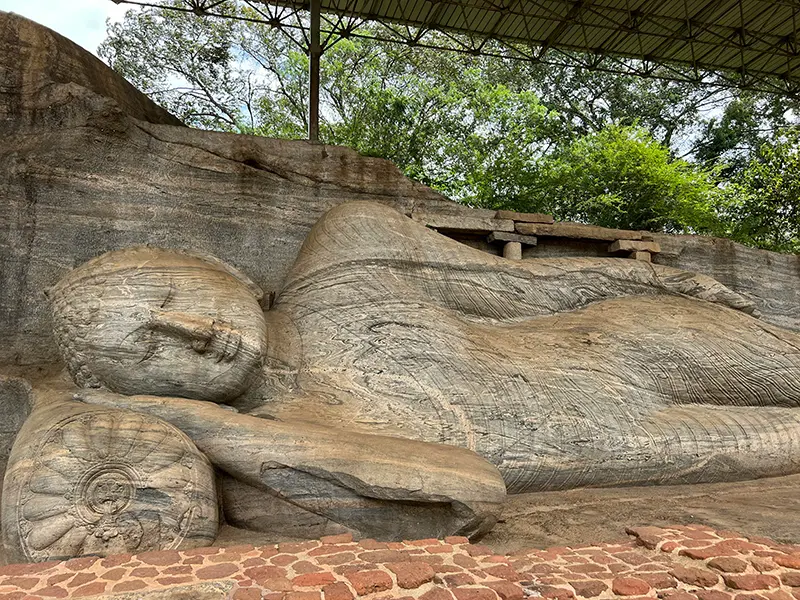 Close-up of the large, 14-meter rock-carved Reclining Buddha statue at Gal Vihara, a sacred site within Polonnaruwa Ancient City.