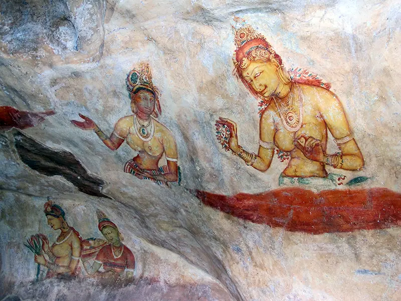 Close-up view of the famous ancient Sigiriya Frescoes—delicate paintings of celestial maidens (Apsaras)—which are a major cultural and historical stop when climbing Sigiriya lion rock.