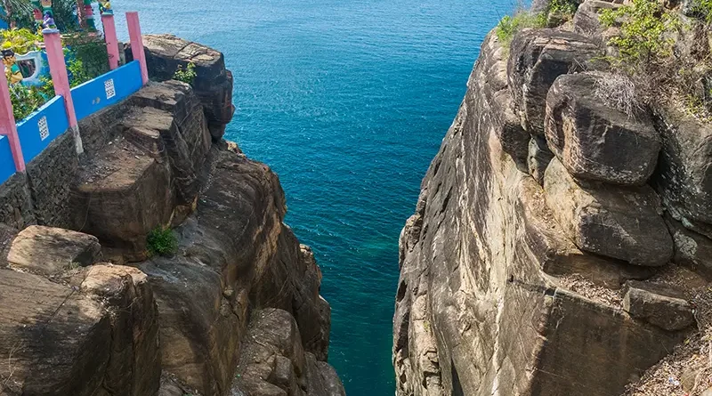 The steep, deep fissure of Ravana's Cleft on Swami Rock Things to Do in Trincomalee, a dramatic cliff face near Koneswaram Temple overlooking the Indian Ocean and historically known as Lover's Leap.