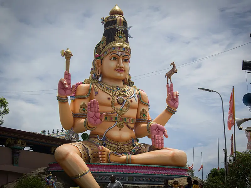 A vibrant, colossal statue of a multi-armed Hindu deity (likely Shiva or a related god) that represents the spiritual depth of the region, a key stop among things to do in Trincomalee.